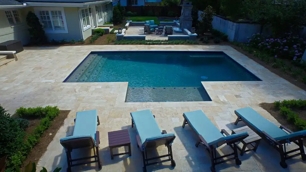 20-modern_pool_with_travertine_decking_port_orange_florida.jpg
