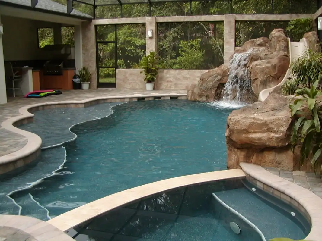 34-Free-form-pool-with-spa-grotto-slide-benches.jpg