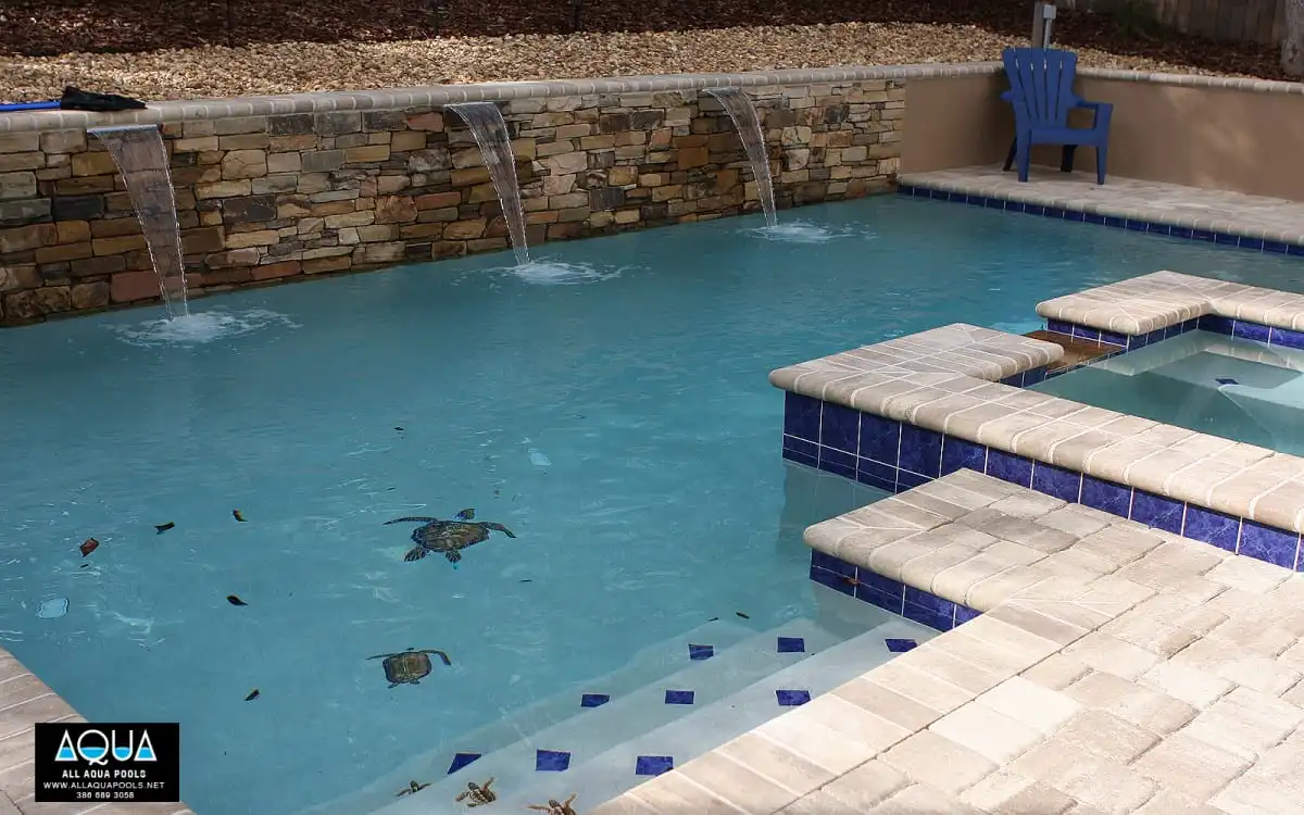 37-modern-pool-with-turtle-mosaics-and-blue-tile.jpg
