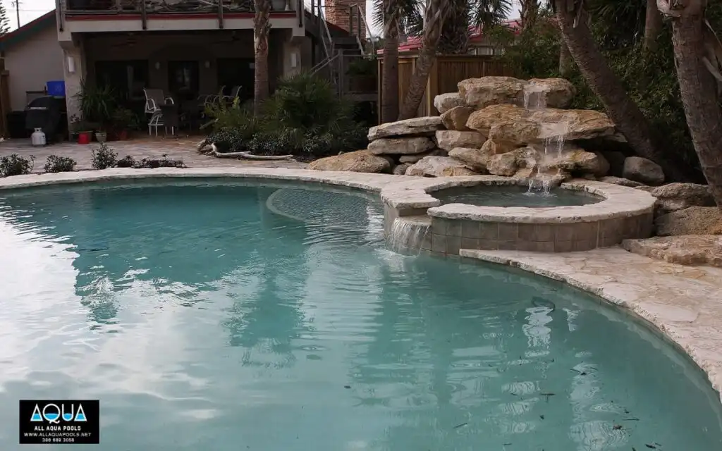 49-Spa-with-rock-waterfall-in-free-form-pool.jpg