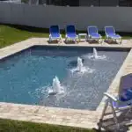 Modern-pool-with-huge-sun-shelf-and-three-bubblers.jpg