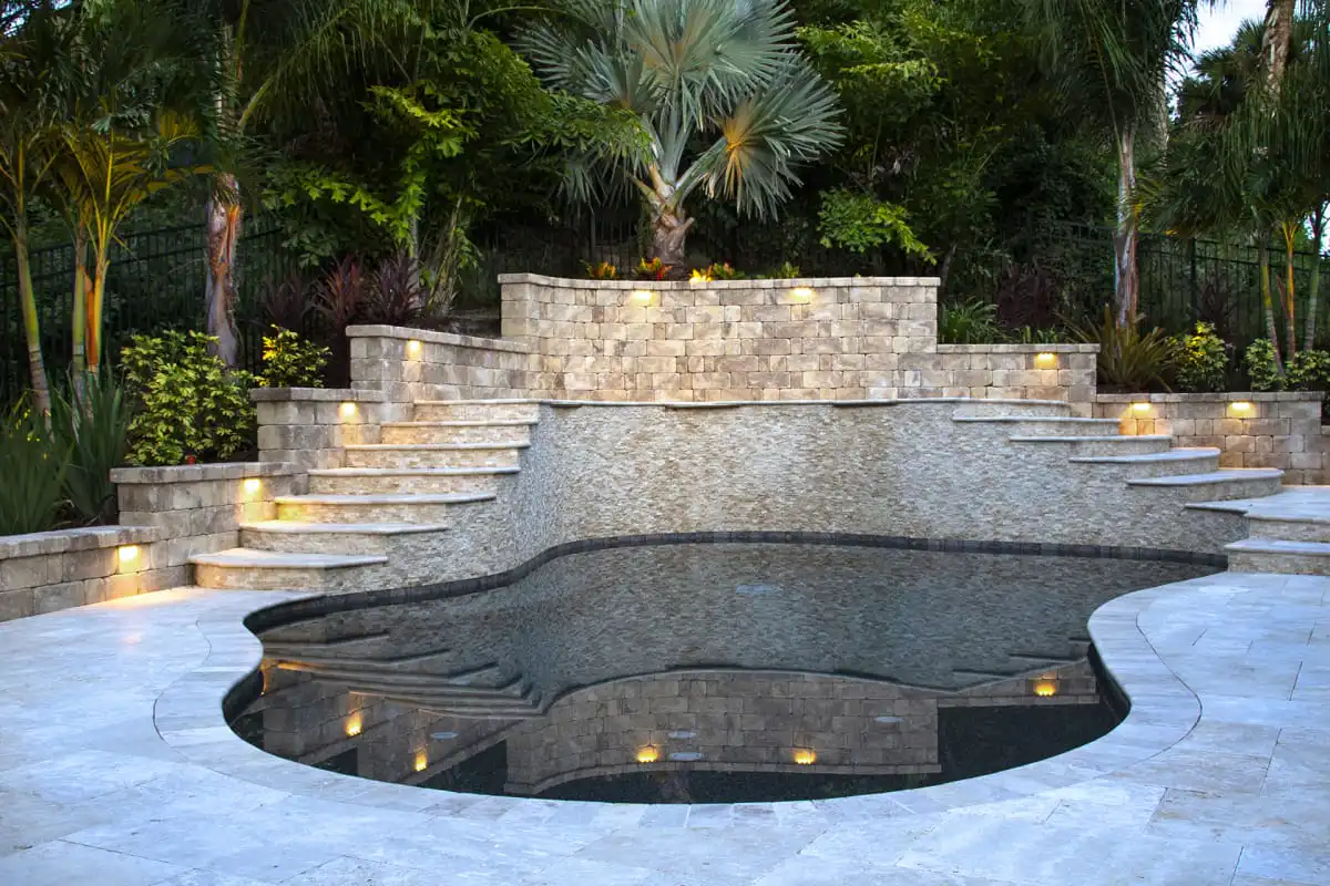 Retaining-wall-with-split-sage-travertine-cladding.jpg