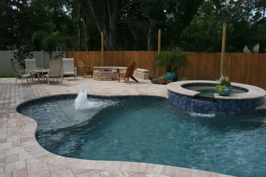 free_form_pool_with_spa_sun_shelf_and_stairs_port_orange_florida.jpg